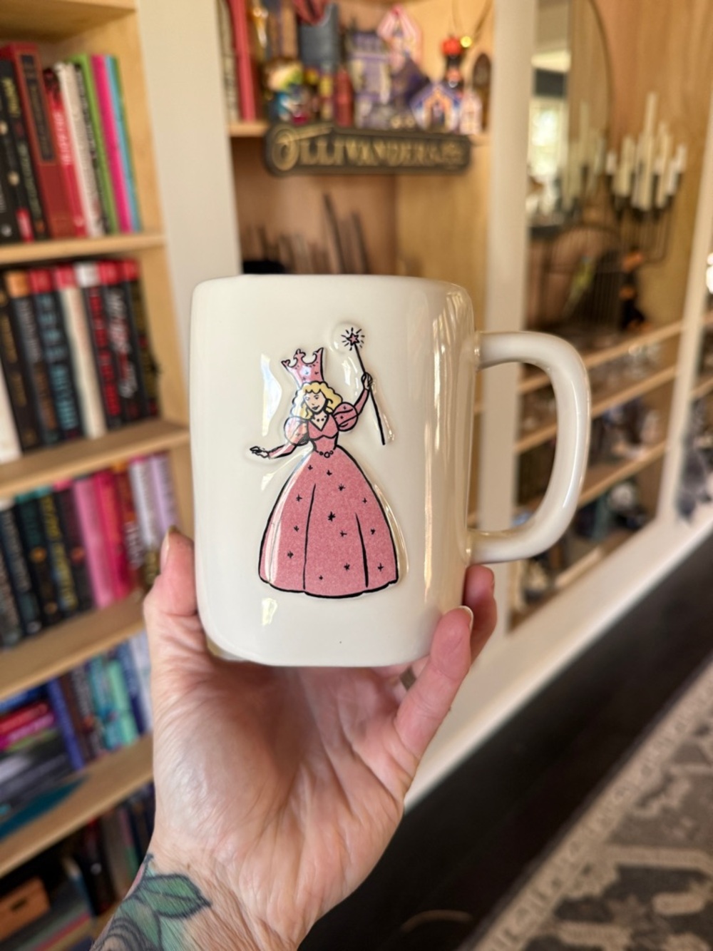 Wizard of oz Rae Dunn anniversary Cream Ceramic Mug with fairy godmother Graphic